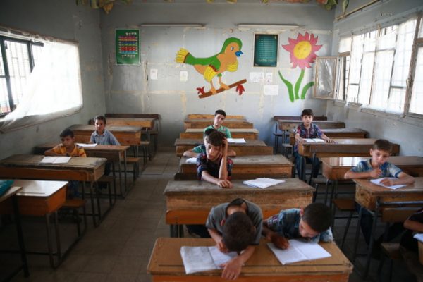 Children attend a summer course in a Douma school that offers accelerated learning courses to those who missed out on their education due to the war in Syria.