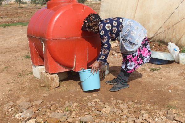 People store water in plastic tanks due to shortages and high prices currently being charged.